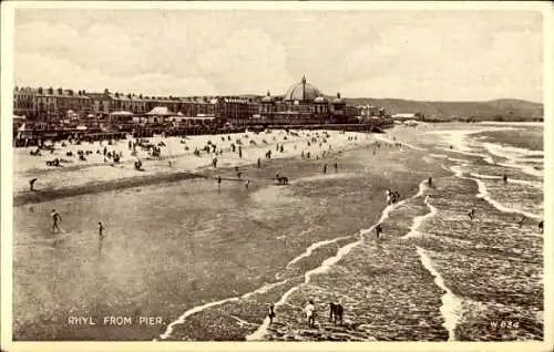 Ak Rhyl Wales, Strandansicht, Pier, Menschen, Gebäude, Wellen, Wolken, nostalgia