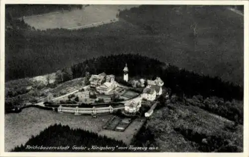 Ak Goslar am Harz, Luftaufnahme von Reichsbauernstadt  Königsberg, Gebäude, Wald