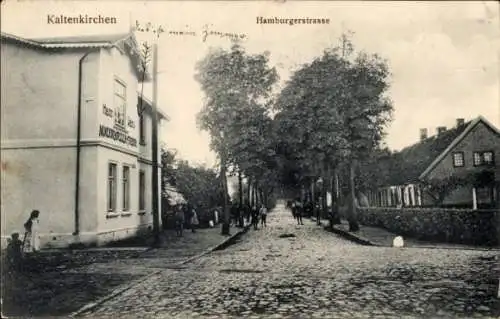 Ak Kaltenkirchen in Holstein ,  Hamburgerstraße, Gebäude mit Schriftzug, Straßenszene