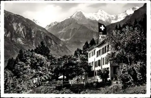 Ak Wilderswyl Wilderswil Kanton Bern Schweiz, Ferienheim Abendberg, Berge, Schweizer Flagge, Bäum