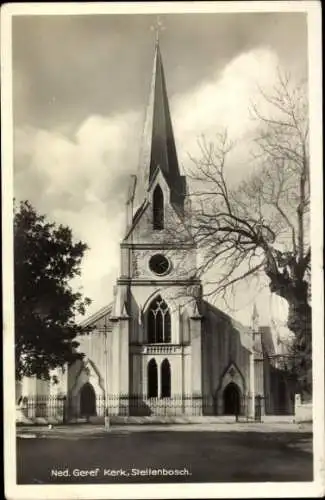 Ak Stellenbosch Südafrika , Ned. Geref Kerk, graue Kirche, hoher Turm, kahle Bäume