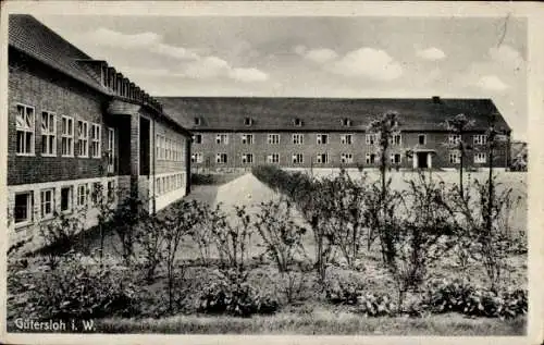 Ak Gütersloh in Westfalen, Gebäude, Blumenbeete, Landschaft mit Wolken