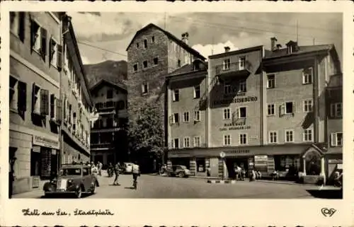 Ak Zell am See in Salzburg, Stadtplatz, Landesreisesbüro, Carl Perler, alte Gebäude, Autos