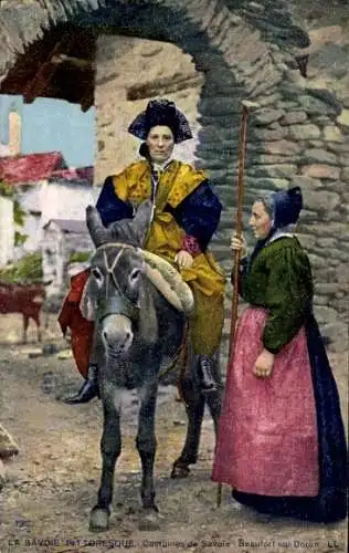 Ak Beaufort Savoie, Eine Frau in traditioneller Tracht reitet auf einem Esel