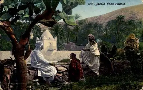 Ak Tunis Tunesien, Jardin dans l'oasis, Personen in traditioneller Kleidung, Palmen