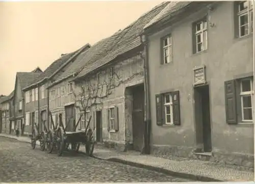 Foto Treuenbrietzen in Brandenburg, Straßenpartie, Fuhrwerke, 2. März 1941