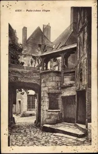 Ak Gien Loiret,  von  Puits à deux Etages, mittelalterliches Gebäude, enge Gasse