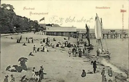 Ak Ostseebad Heringsdorf auf Usedom, Strand, Menschen am Wasser, Segelboot, Holzpier