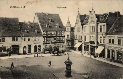 Ak Cöthen Köthen in Anhalt, Holzmarkt,  Gebäude, Brunnen, Straßenszene