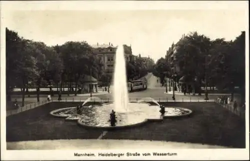 Ak Mannheim in Baden, Brunnen mit Wasserfontäne, Heidelberger Straße, Tram, Bäume, Gebäude