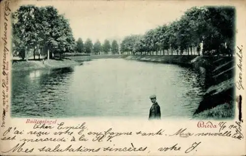 Ak Breda Nordbrabant Niederlande, Mann steht an einem Kanal, im Hintergrund eine Allee mit Bäu...