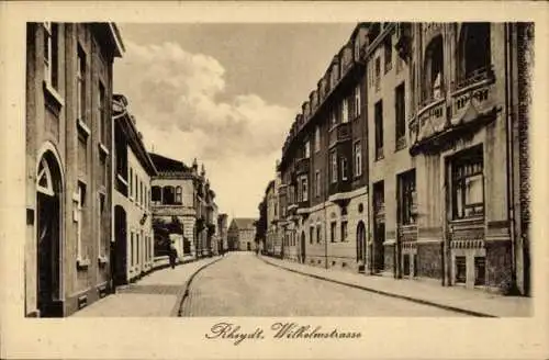 Ak Rheydt Mönchengladbach am Niederrhein, Straße mit n Gebäuden, Wolken am Himmel, Wilhelmstrasse