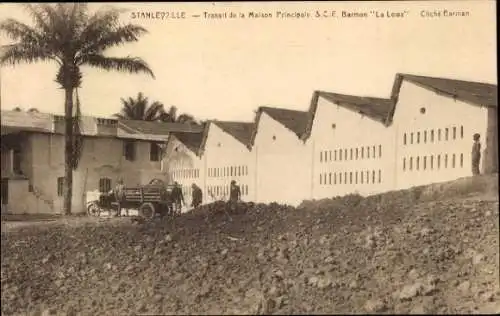 Ak Kisangani Stanleyville DR Kongo Zaire, Gebäude mit Garage, Palmbaum, historische Architektu...