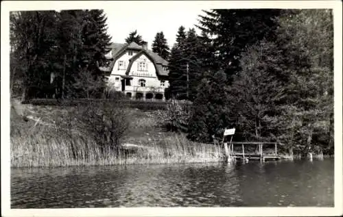 Ak Flecken Zechlin Rheinsberg in der Mark, Haus Elsenhöbe, umgeben von Bäumen, am Wasser, Holzste
