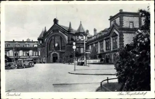 Ak Osnabrück in Niedersachsen, Historisches Gebäude, Hauptbahnhof, Autos, Schwarz-Weiß-Foto