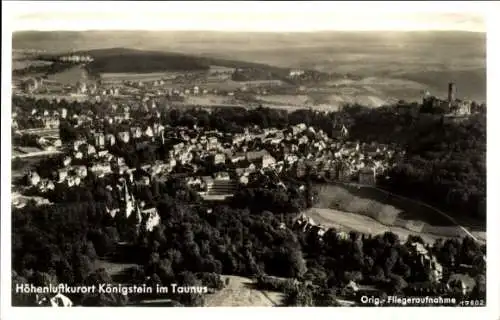 Ak Königstein im Taunus, Luftaufnahme von Königstein, Häuseransicht, Hügelkulisse, Burgruine