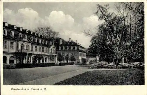 Ak Wilhelmsbad Hanau am Main Hessen, Historisches Gebäude, Parkanlage, Wolken am Himmel, nansicht