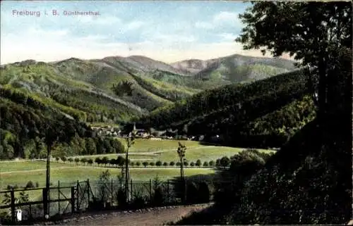 Ak Günterstal Freiburg im Breisgau, Berglandschaft, kleines Dorf, Fluss, grüne Wälder, blauer Him