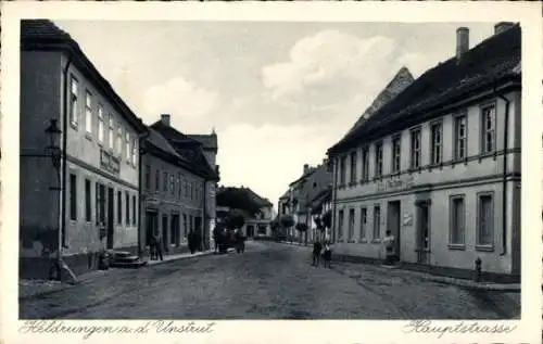 Ak Heldrungen in Thüringen, Historische Straße, Gebäude, Wolken, schwarz-weiß, Hauptstraße