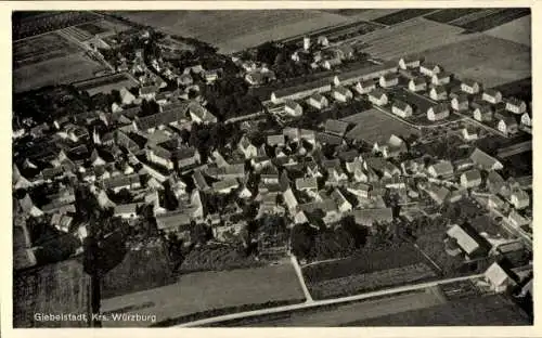 Ak Würzburg am Main Unterfranken, Luftaufnahme von Giebelstadt, viele Wohnhäuser, Felder