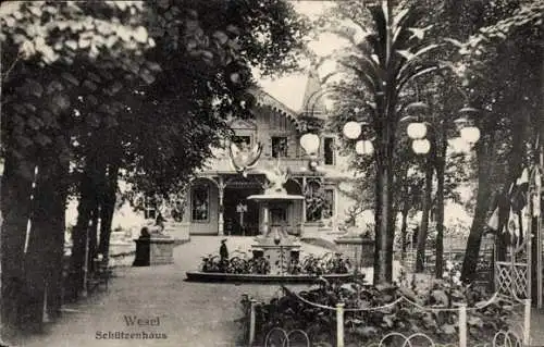 Ak Wesel am Niederrhein,  Schützenhaus, Park mit Bäumen, Laternen, Brunnen