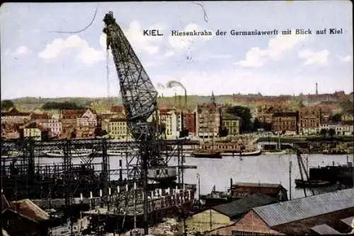 Ak Kiel, Riesenkran der Germaniawerft, Blick auf  Hafenansicht