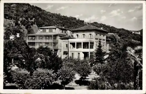 Ak Lugano Kanton Tessin Schweiz, Kurhaus Casa di Cura, Gebäude, Bäume, Landschaft