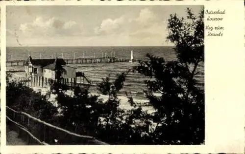 Ak Ostseebad Koserow auf Usedom, Ostseebad  Weg zum Strande, Küstenansicht, Pier