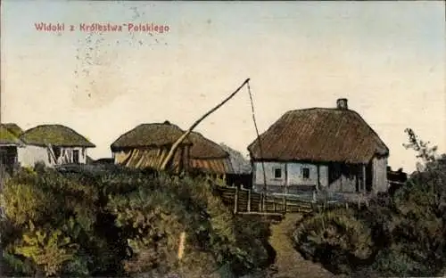 Ak Polen, Dorfidyll, Reetdachhäuser, Brunnen