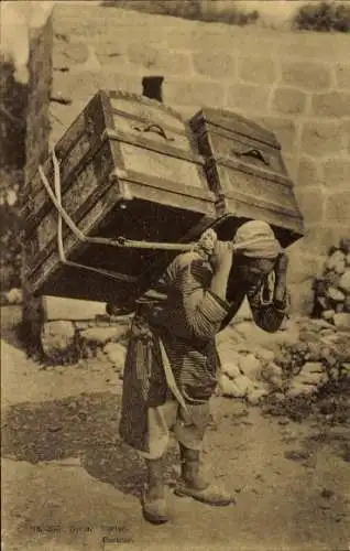 Ak Syrien, Mann trägt schwere Kisten, Träger