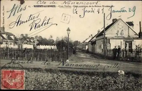 Ak Nonancourt Eure, Straße in  Häuser, Laterne, Menschen,  