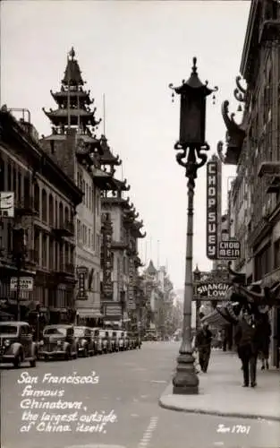 Ak San Francisco Kalifornien USA, San Francisco's Chinatown, große Gebäude, elektrische Straße...