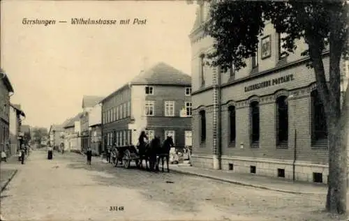 Ak Gerstungen in Thüringen, Wilhelmstrasse,  , Kutsche, Gebäude mit Post