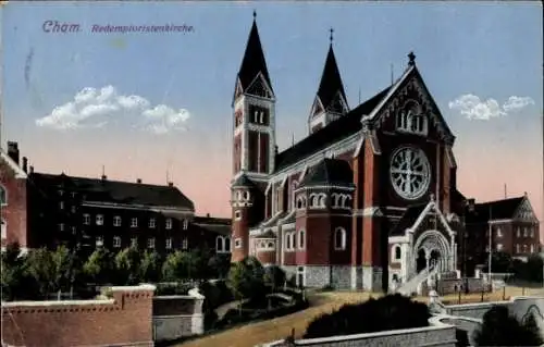 Ak Cham in der Oberpfalz, Redemptoristenkirche, mit Türmen, rosa Himmel, Gebäude im Vordergrund