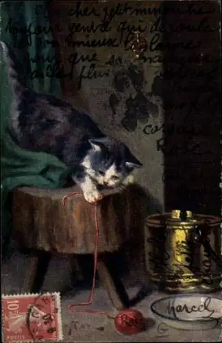 Ak Schwarz-weiße Katze spielt mit einem roten Wollknäuel