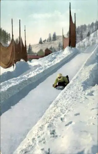 Ak Wintersport, Skeleton Fahrer auf der Rodelbahn