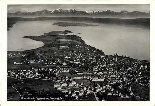 Ak Radolfzell am Bodensee, Luftaufnahme von Radolfzell, Bodensee, Alpen im Hintergrund