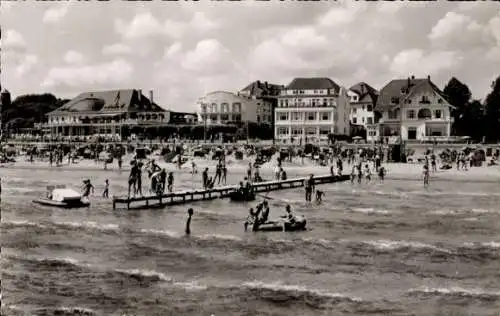 Ak Ostseebad Travemünde Lübeck, Strand, Sonnenbader, Badegäste, Gebäude, Pier
