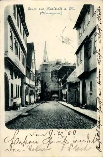 Ak Karlstadt am Main Unterfranken, Gruss aus Karlstadt a. M., Maingasse,  Gebäude, gepflasterte S