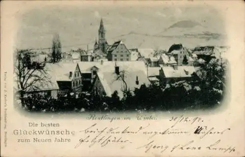 Ak Reutlingen in Württemberg, bild einer winterlichen Stadtansicht, Kirchturm sichtbar, Häuser, S