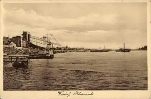 Ak Wiesdorf Leverkusen am Rhein, Rheinansicht, Boote, Hafenanlagen, Wolken über Wasser