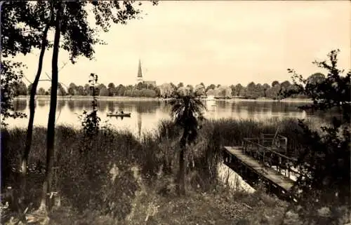 Ak Groß Köris, Partie am Schützen See, Steg, Ruderboot, Kirchturm