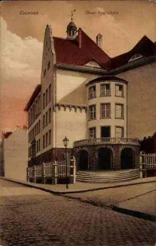 Ak Lutherstadt Eisleben,  Ober-Realschule, Gebäude, Straßenszene,  Architektur