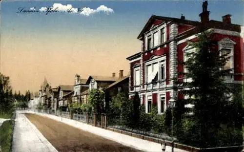 Ak Landau in der Pfalz, Vorderseite zeigt ein Gebäude, Straße, Bäume, Wolken