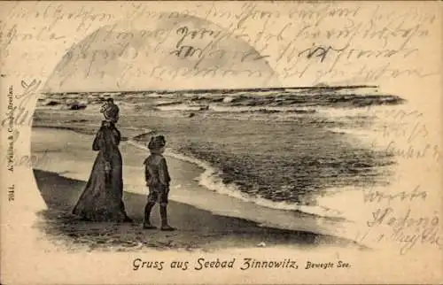 Ak Ostseebad Zinnowitz auf Usedom, Junge und Frau am Strand, Meeresblick, Wellenbewegung, ntext