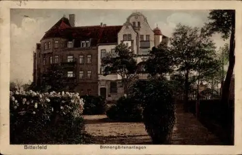 Ak Bitterfeld in Sachsen Anhalt, Bilder von Binnengärtenanlagen,  Gebäude, Bäume, Blumen