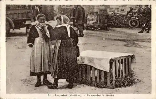 Ak Locminé Morbihan, Frauen in traditioneller Kleidung, Marktstand, ländliche Umgebung