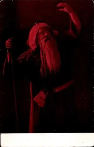 Ak Mann mit langem Bart und Stock hebt die Hand