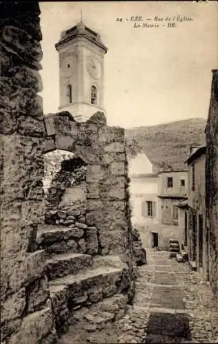 Ak Èze Alpes Maritimes, Straße mit Kirche, alter Steinmauer, Häuserreihe, neugotischer Stil