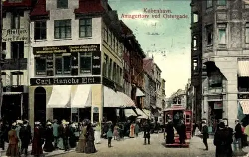 Ak København Kopenhagen Dänemark, Amagertorv, Ostergade,  Architektur, Straßenbahn, Menschenmenge